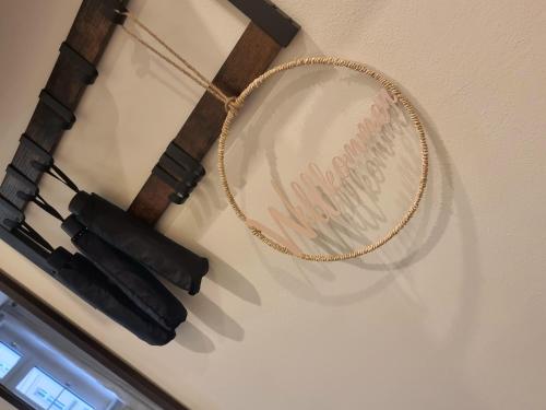 a hoop hanging on a wall with two guns at Altstadt-oase in Cottbus