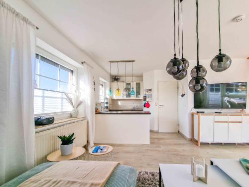 a room with a kitchen and a dining room at Nimo 2 in Greetsiel