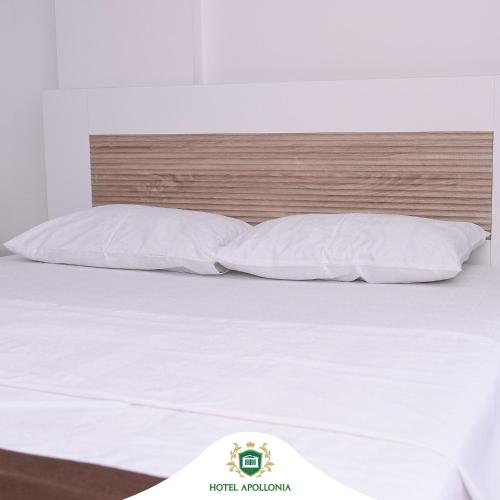 Ένα ή περισσότερα κρεβάτια σε δωμάτιο στο Hotel Apollonia