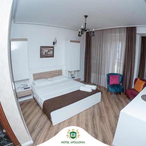 Ένα ή περισσότερα κρεβάτια σε δωμάτιο στο Hotel Apollonia