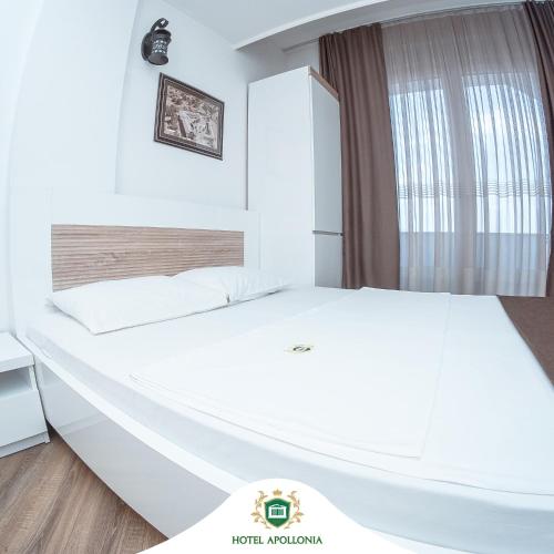 Ένα ή περισσότερα κρεβάτια σε δωμάτιο στο Hotel Apollonia