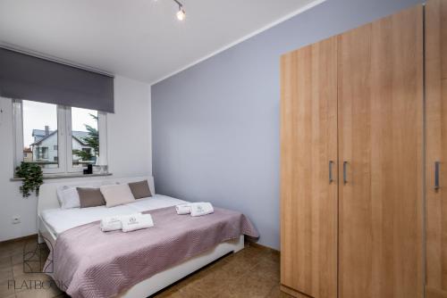 Katil atau katil-katil dalam bilik di Flatbook Apartamenty - Krynica Morska Gdańska