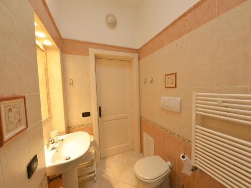 a bathroom with a toilet and a sink at Vacation home with private pool, Floridia in Floridia
