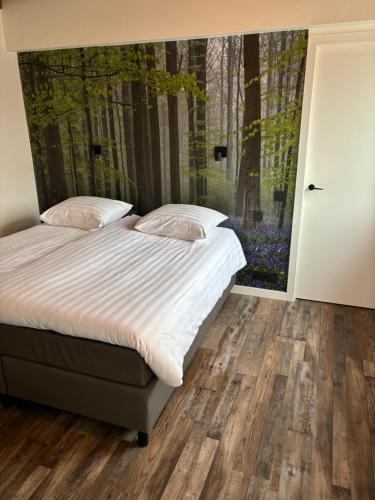 Cama o camas de una habitación en B&B Sint-Mariaburg