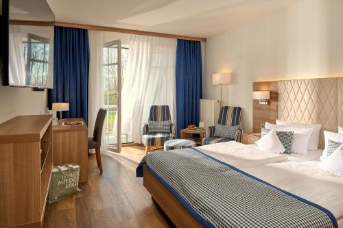 Postel nebo postele na pokoji v ubytování Hotel Bernstein