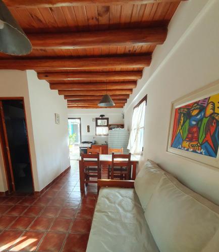 a living room with a couch and a table at Medanos in Las Gaviotas