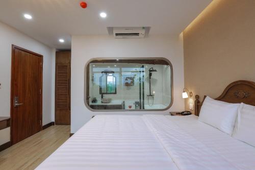 Cama o camas de una habitación en Maya Hotel 4