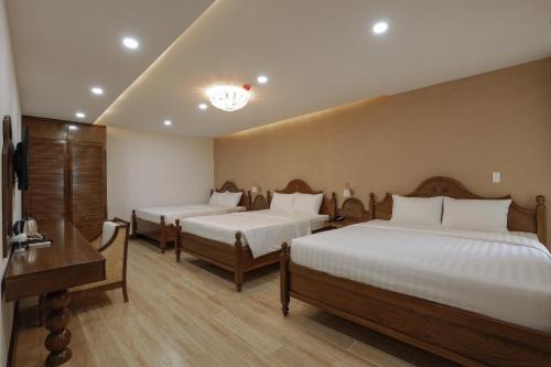 Cama o camas de una habitación en Maya Hotel 4