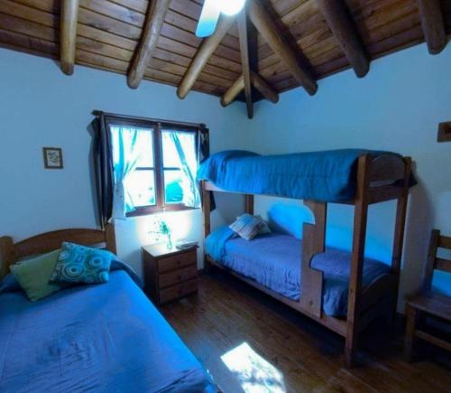 Una cama o camas cuchetas en una habitación  de Medanos