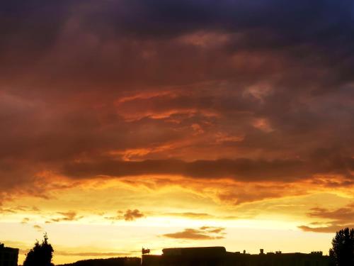 an image of a sunset with clouds at Dom w lesie in Łukta