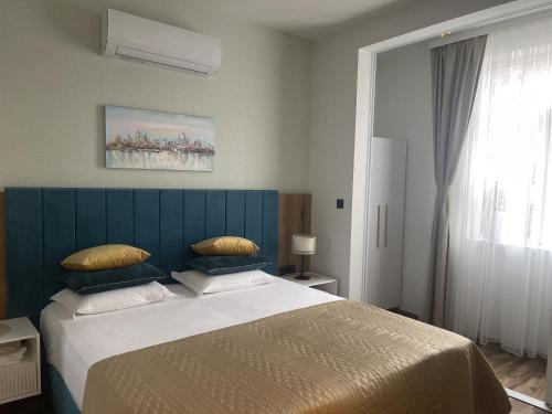 Postel nebo postele na pokoji v ubytování RELAX апартаменти - гр.ДИМИТРОВГРАД