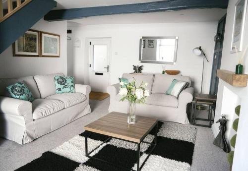 Et opholdsområde på White Cottage deluxe 2 bedroom apartment