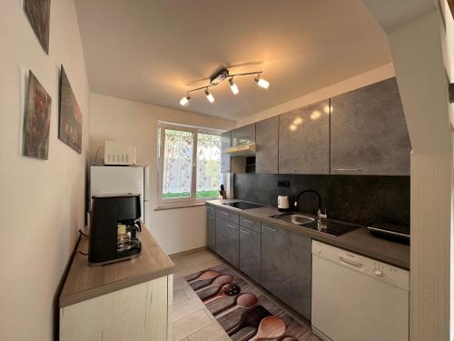 a kitchen with a sink and a counter top at Villa Anthony in Rovinj