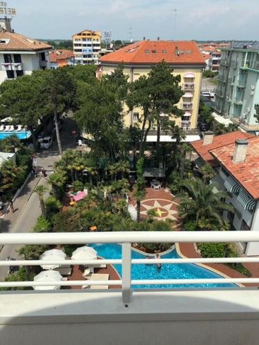 a balcony with a view of a pool and buildings at Park Hotel Pineta Boutique Hotel in Caorle