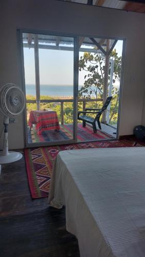 Postel nebo postele na pokoji v ubytování Puerta al Mar Ecolodge Glamping