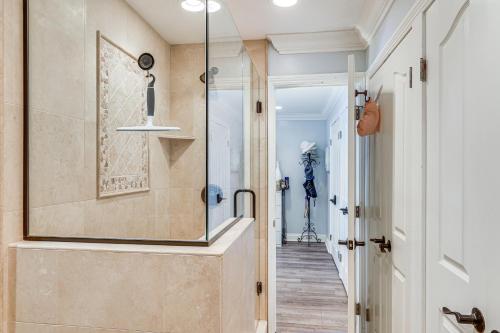 a walk in shower in a bathroom with a glass door at Bright Condo with Balcony, Steps to Oceanside Beach! in Oceanside