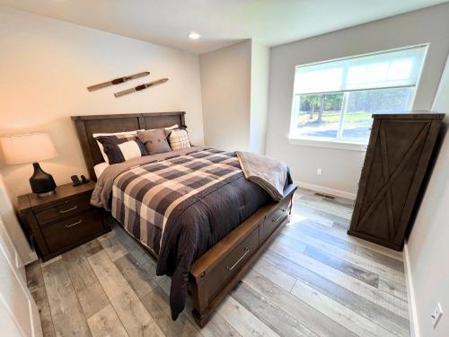 a bedroom with a large bed and a window at Timber Ridge in Columbia Falls