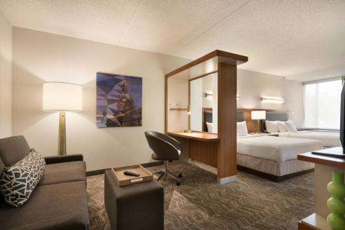 a hotel room with a bed and a desk at SpringHill Suites Ewing Township Princeton South in Ewing