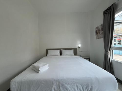 Muangchan Hotelにあるベッド