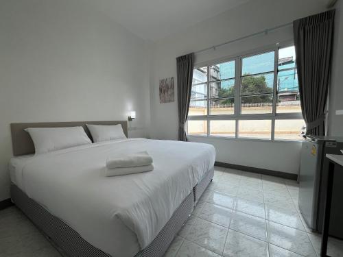 Muangchan Hotelにあるベッド