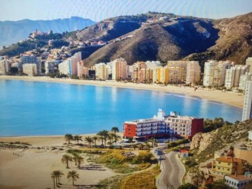 a view of a city with a beach and buildings at Piso a 3 minutos de la playa!! 6 personas in Cullera