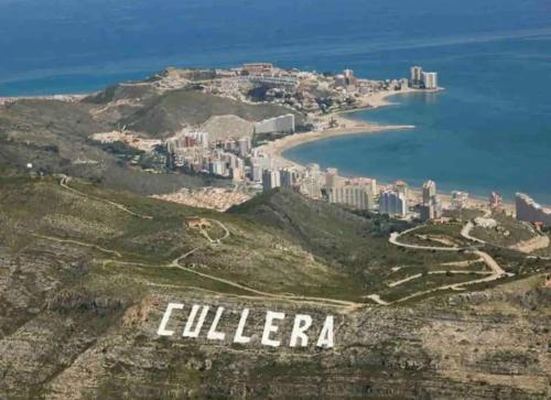 an aerial view of the city of cullerara on a mountain at Piso a 3 minutos de la playa!! 6 personas in Cullera