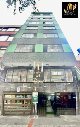 a tall building with a sign in front of it at Hotel el Duque Internacional, Bogotá in Bogotá