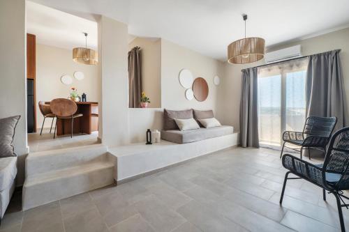 a living room with a couch and a table at Casa di Demezzo in Sitia