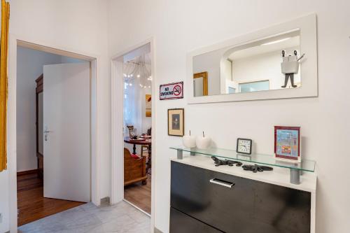 a bathroom with a sink and a mirror at Wohnung Belle Epoque in Baden-Baden