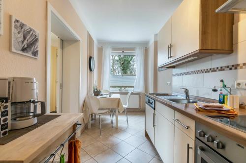 a kitchen with a sink and a counter top at Alte Schule Pahlkrug in Linden