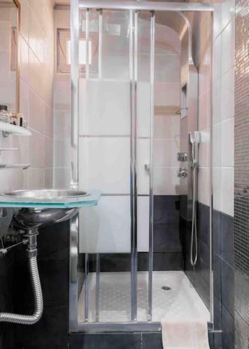 a bathroom with a shower and a sink at Argostoli`s Heard in Argostoli