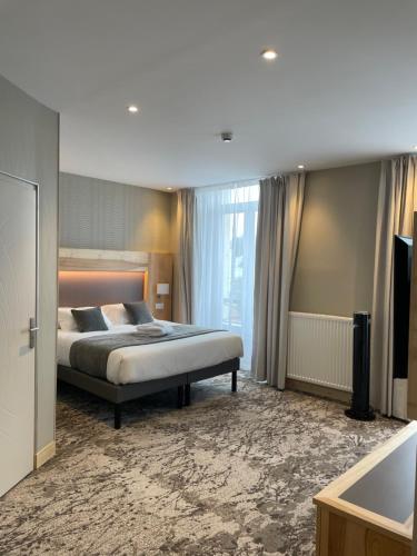 Ένα ή περισσότερα κρεβάτια σε δωμάτιο στο Hotel Le Cercle