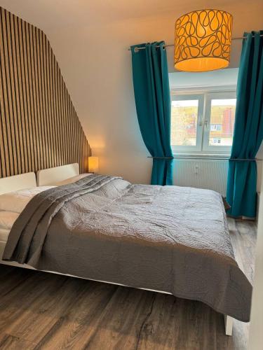 Katil atau katil-katil dalam bilik di Ferienwohnung Lohfelden Vibes