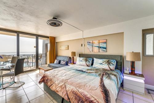 a bedroom with a bed and a balcony at Daytona Beach Resort Studio with Beach Access! in Daytona Beach