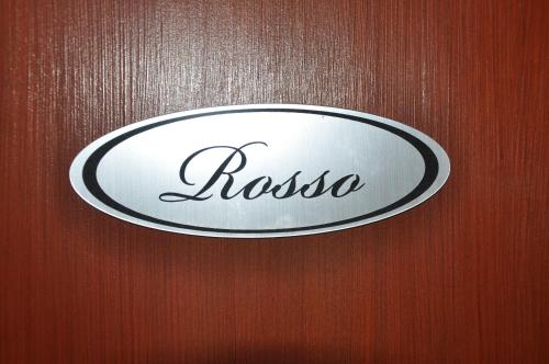 a door with a sign that says rosso on it at Apartamenty Lawenda in Rabka
