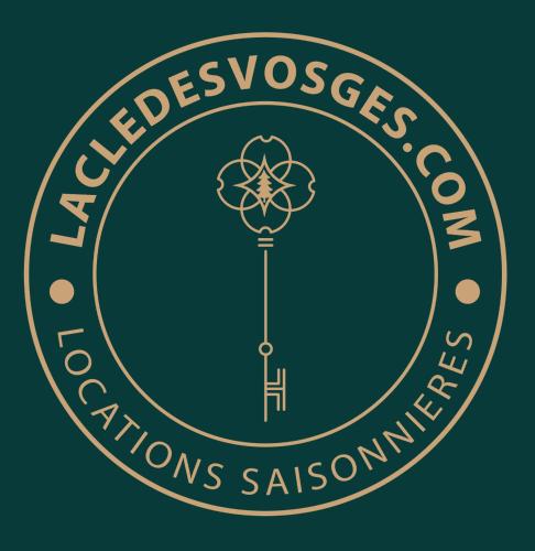 a logo for the montessori nations assurance school at Chalet L'Urson, spacieux, jacuzzi, hammam et sauna in Gérardmer