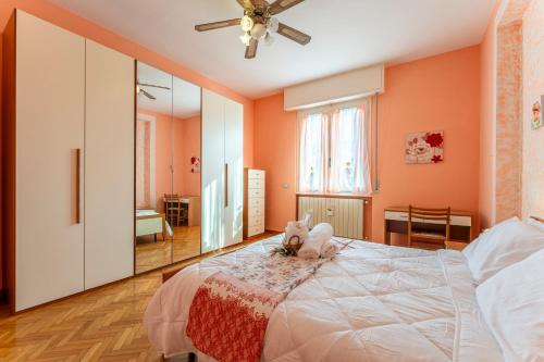 a bedroom with a bed with a stuffed animal on it at Leandro's House Near Thermal Baths in Montecatini Terme