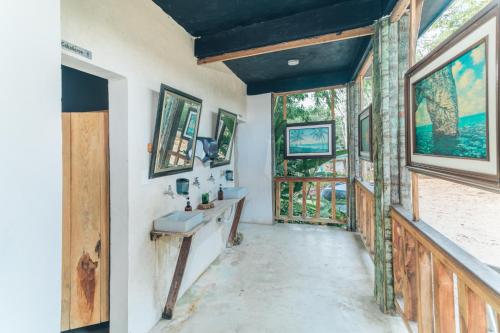 a bathroom with a sink and a window at Embajada Universal By La Eufemia Group in Huay Pix