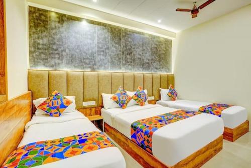 a room with two beds at Hotel Wind Flower Inn Near International Airport in Mumbai