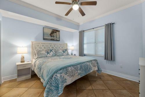 a bedroom with a bed and a ceiling fan at Palazzo #505 by Nautical Properties in Panama City Beach