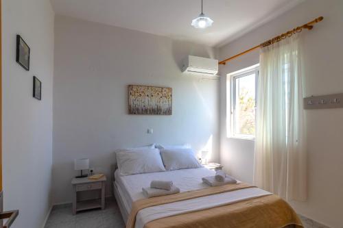 Postel nebo postele na pokoji v ubytování Beachside Apartment-1