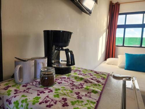 a coffee maker sitting on top of a table at Fitz-Mar in Isla Mujeres