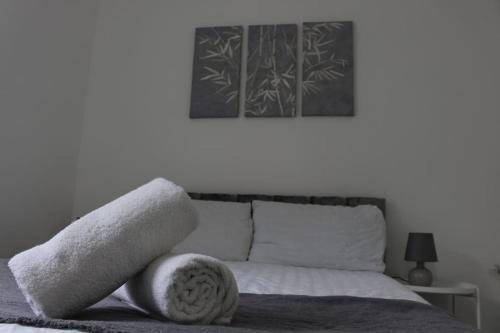 a bed with white towels on top of it at BrAnD NeW StuNNing Studio FlaT! in London