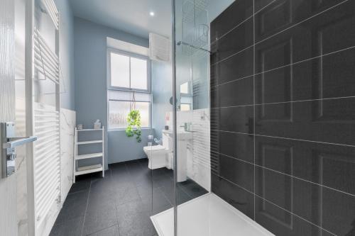 a bathroom with a toilet and a sink at The Apartments Coniston in Coniston