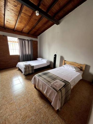 A bed or beds in a room at Casa amplia, en lugar tranquilo