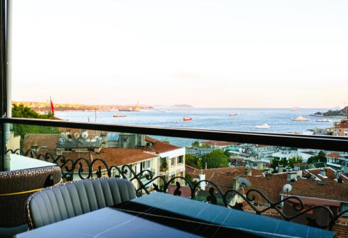 a view of the ocean from a balcony at Sing Of Hotel & Suites Taksim Istanbul in Istanbul