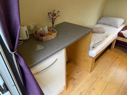 a room with a table and a bed in a room at Belle Vista Glamping & Camping in York