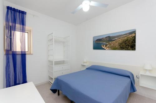 En eller flere senge i et værelse på Villa Lucia