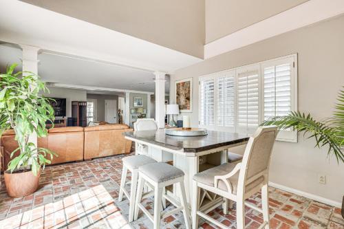 a kitchen and living room with a table and chairs at Escondido Home Private Pool, 2 Grills and Fire Pit! in Escondido