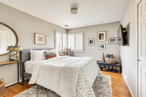 a bedroom with a bed with a white comforter at Escondido Home Private Pool, 2 Grills and Fire Pit! in Escondido